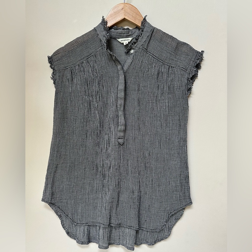 Lightweight button up blouse with frayed details.